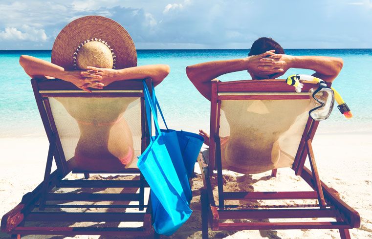 A couple relaxing on the beach