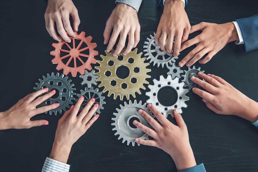 multiple hands on gears