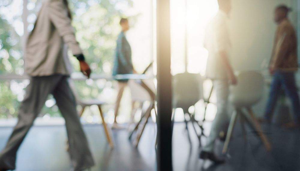 People walking inside an office