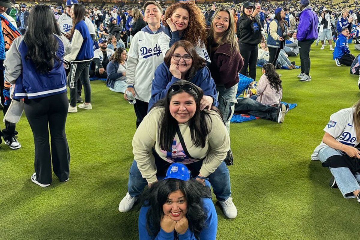 six people stacked like a pyramid