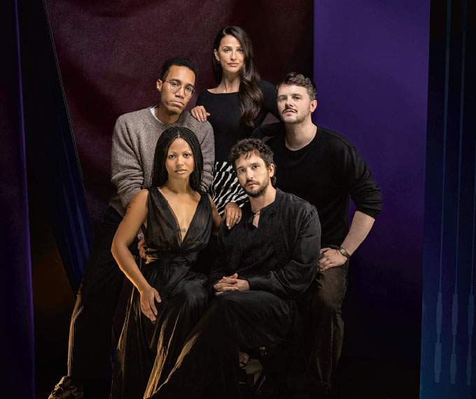 five people posing for a photo