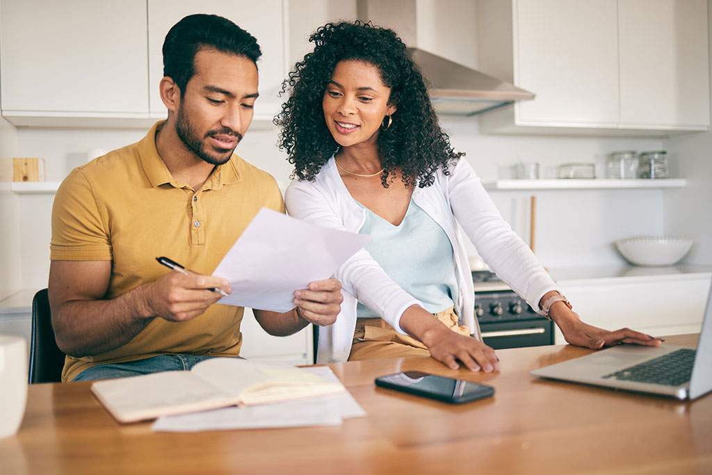 man and woman going over paperwork
