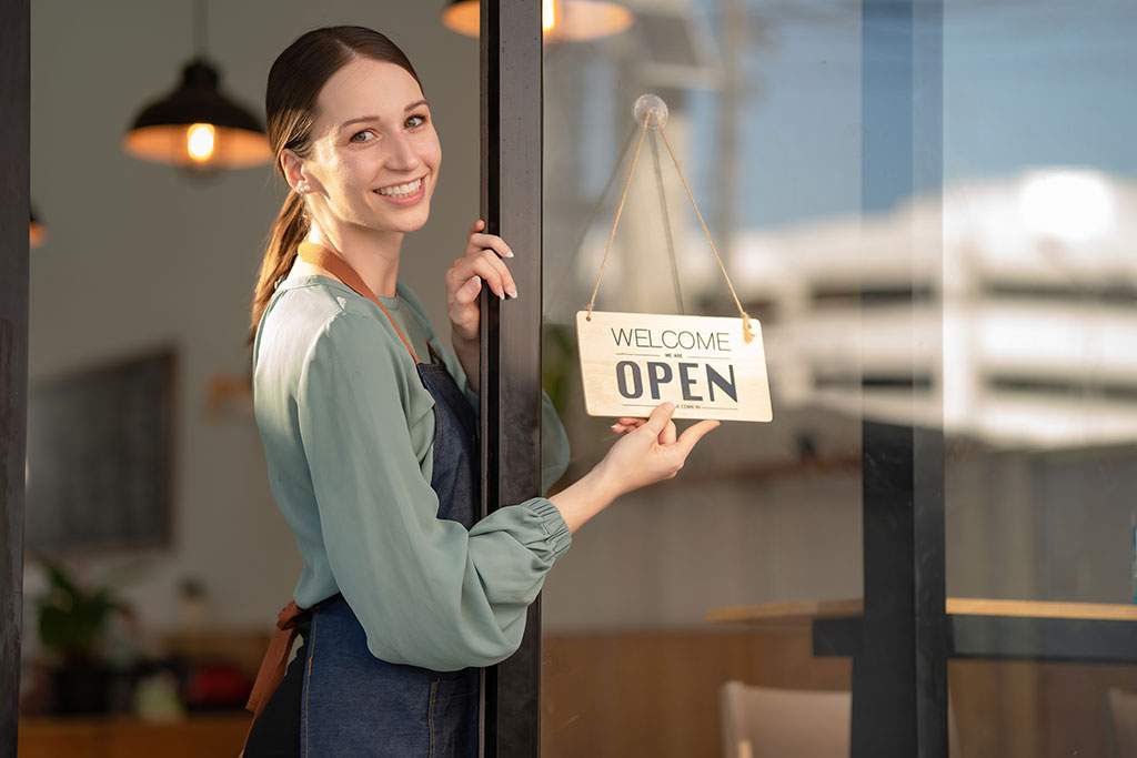 woman with an open sign