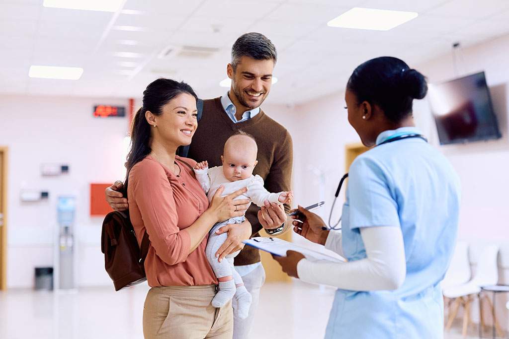 family at hospital with doctor